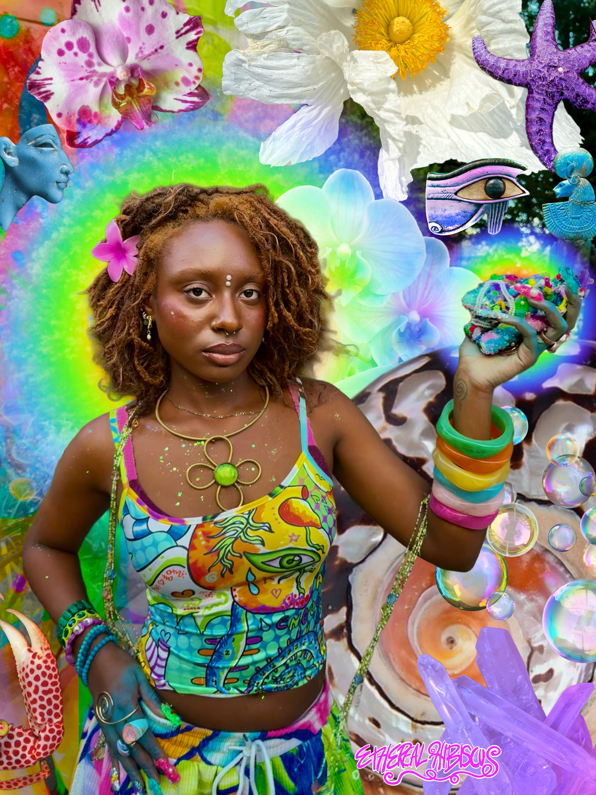 A woman with curly brown hair stands against a highly colorful, surreal collage background featuring flowers, a starfish, bubbles, and abstract art. She is wearing a bright multicolor tank top and matching bottoms, accessorized with colorful bracelets, a green pendant necklace, and a pink flower in her hair.