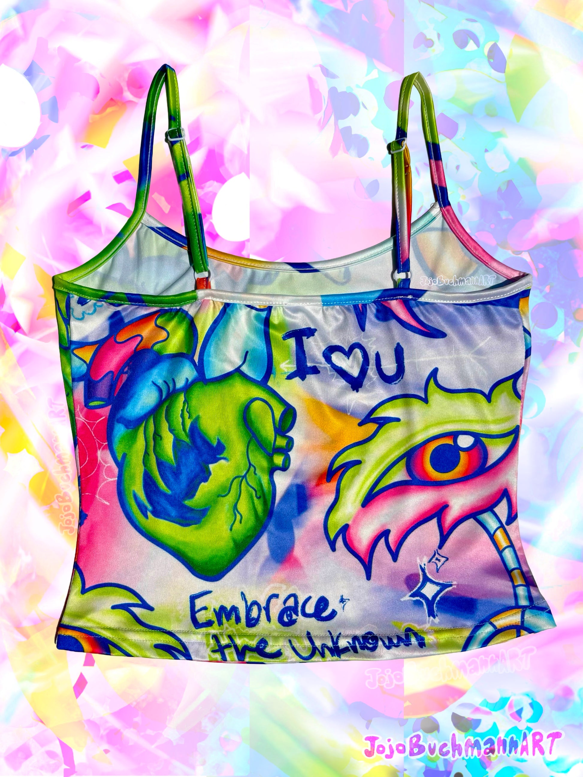 A colorful graphic tank top featuring a stylized anatomical heart, a large eye, and the text 'I [heart] U' and 'Embrace the Unknown' on a white base, set against a vibrant, abstract pastel background.